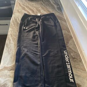 Girls  YXL under Armour black pants with white writing on side of pants